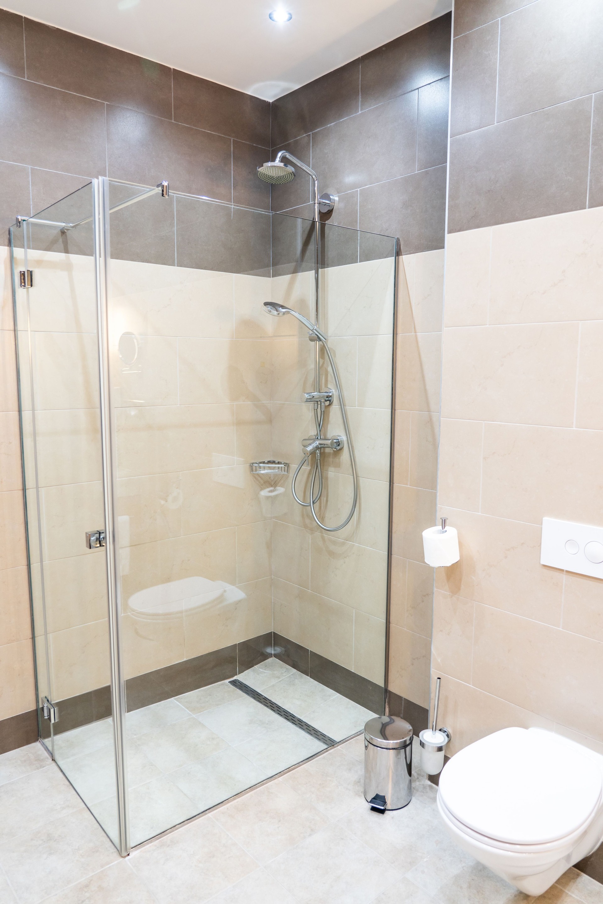 Glass shower walk in cabin in modern interior
